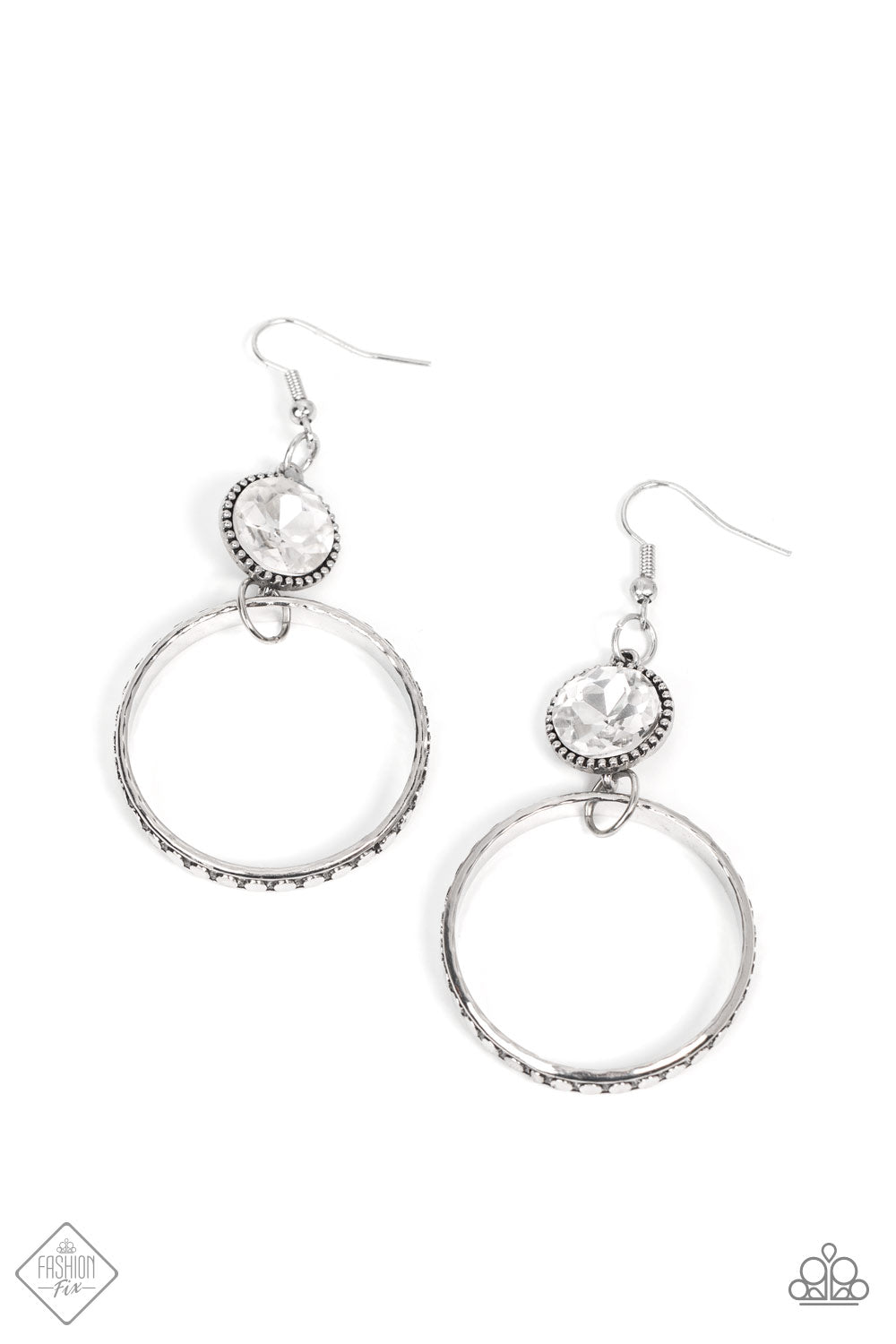 Standalone Sparkle White Earring - Paparazzi Accessories  The outer edge of a silver ring is stamped with a flattened dot motif as it swings below a dramatic white rhinestone that sparkles inside a daintily dotted antiqued silver frame, creating an upscale, edgy modern lure. Earring attaches to a standard fishhook fitting.  Sold as one pair of earrings.