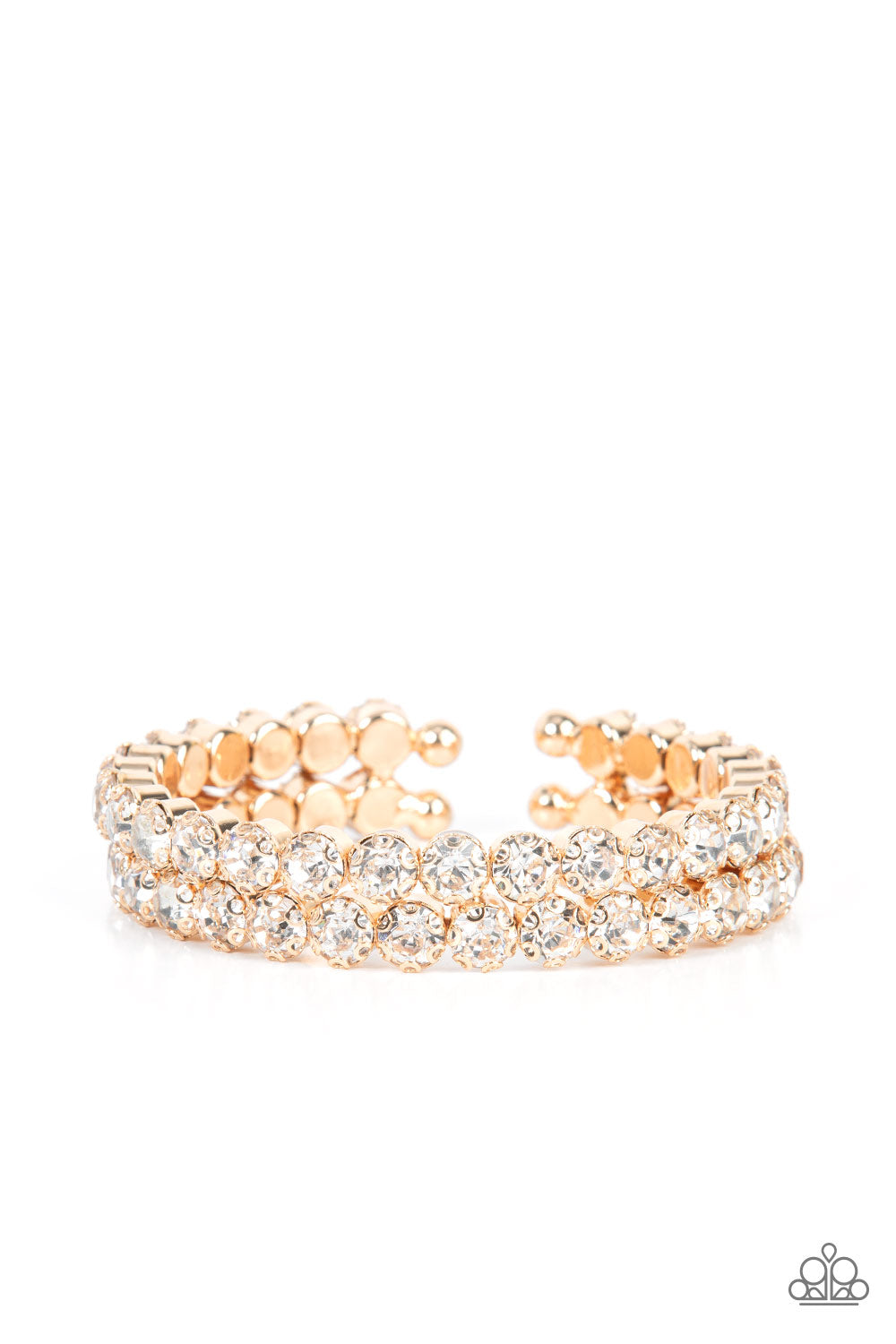 Megawatt Majesty Gold Cuff Bracelet - Paparazzi Accessories  Encased in sleek gold fittings, two oversized rows of glassy white rhinestones stack into a blinding cuff around the wrist for a jaw-dropping look.  Sold as one individual bracelet.