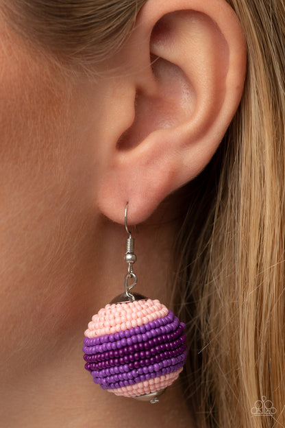 Zest Fest Purple Earring - Paparazzi Accessories  Strands of Pale Rosette, purple, and plum seed beads decoratively spin around a spherical frame, resulting in a colorful 3-dimensional display. Earring attaches to a standard fishhook fitting.  Sold as one pair of earrings.