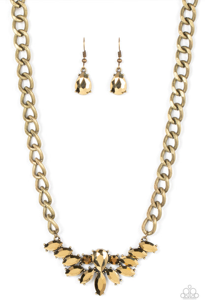 Come at Me Brass Necklace - Paparazzi Accessories  Glitzy marquise cut aurum rhinestones fan out from the bottom of an oversized teardrop aurum rhinestone, resulting in a gritty pendant at the bottom of a chunky brass chain for a sassy statement. Features an adjustable clasp closure.  Sold as one individual necklace. Includes one pair of matching earrings.