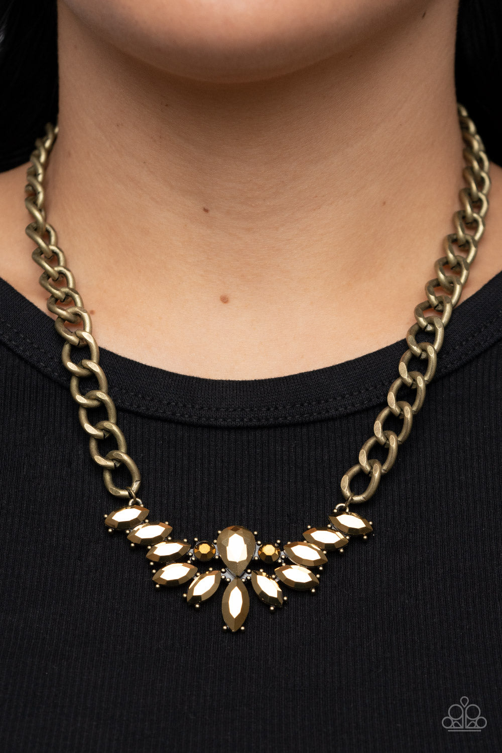 Come at Me Brass Necklace - Paparazzi Accessories  Glitzy marquise cut aurum rhinestones fan out from the bottom of an oversized teardrop aurum rhinestone, resulting in a gritty pendant at the bottom of a chunky brass chain for a sassy statement. Features an adjustable clasp closure.  Sold as one individual necklace. Includes one pair of matching earrings.