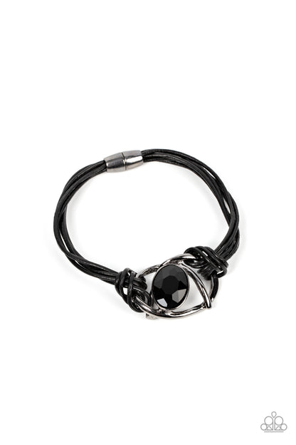 Keep Your Distance Black Magnetic Bracelet - Paparazzi Accessories  Shiny gunmetal bars abstractly twist around an oversized oval black gem, resulting in a mesmerizing centerpiece that is knotted in place with layers of black leather cording. Features a magnetic closure.  Sold as one individual bracelet.