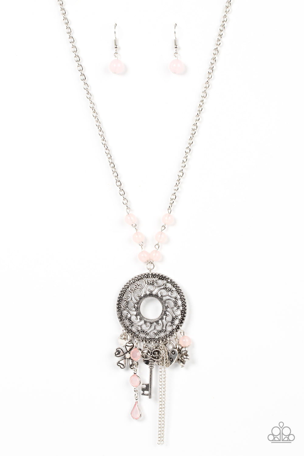 Making Memories - Pink Item #P2WH-PKXX-452XX Infused with glassy Pale Rosette beaded accents, a whimsical assortment of silver key, heart, and floral charms cascades from an oversized studded silver frame that whirls with heart shaped vine-like filigree. The ornate frame swings from the bottom of a Pale Rosette beaded silver chain, adding a flirtatious pop of color to the sensational fringe. Features an adjustable clasp closure.  Sold as one individual necklace. Includes one pair of matching earrings.