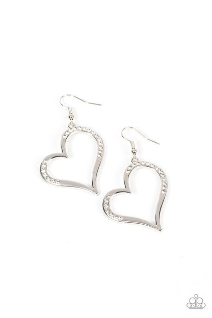 Tenderhearted Twinkle White Earring - Paparazzi Accessories  A curvaceous silver heart is encrusted in sections of glassy white rhinestones, invoking a flirtatious flair. Earring attaches to a standard fishhook fitting.  Sold as one pair of earrings.