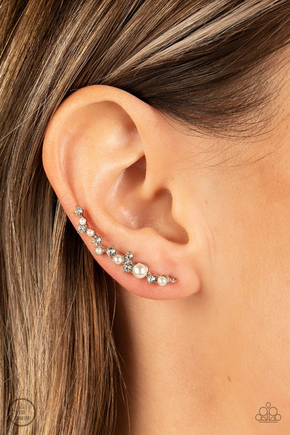 Couture Crawl White Ear Crawler Earring - Paparazzi Accessories  A bubbly assortment of dainty white rhinestones and white pearls gently climbs the ear for a timeless fashion statement. Features an extended post fitting that climbs the back of the ear and can be pressed together for a more secure fit.  Sold as one pair of ear crawlers.