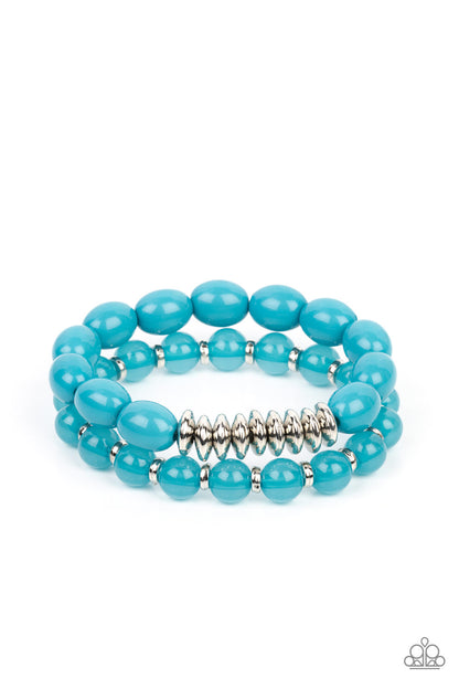 La Vida Vacation Blue Bracelet - Paparazzi Accessories  Infused with silver accents, rows of glassy and acrylic blue beads are threaded along stretchy bands around the wrist, resulting in a refreshing pop of color.  Sold as a pair of bracelets.  P9WH-BLXX-268FI  Get The Complete Look! Necklace: "Venetian Voyage - Blue" (Sold Separately)