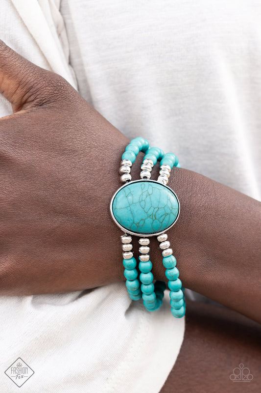 Stone Pools Blue Bracelet - Paparazzi Accessories  Layers of turquoise beads are threaded along stretchy bands that connect to a stunning oval turquoise stone, creating an extraordinary statement piece around the wrist.  Sold as one individual bracelet.