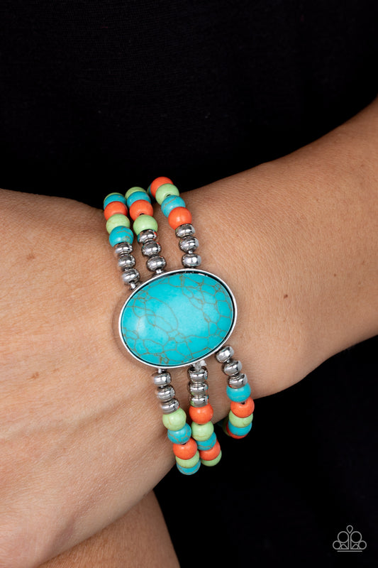 Stone Pools Multi Bracelet - Paparazzi Accessories  Layers of turquoise, green, and orange stone beads are threaded along stretchy bands that connect to a stunning oval turquoise stone, creating an extraordinary statement piece around the wrist.  Sold as one individual bracelet.