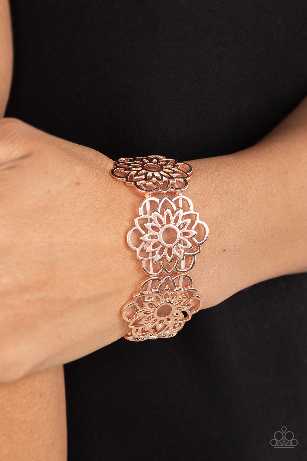 Baroque Bouquet Gold Bracelet - Paparazzi Accessories  Airy rose gold petals bloom into mandala-like blossoms along stretchy bands around the wrist, creating a regal floral pattern.  Sold as one individual bracelet.