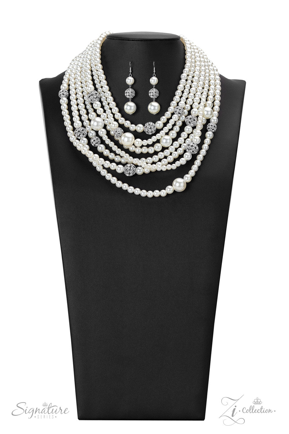 The Courtney 2022 Zi Collection Necklace - Paparazzi Accessories  Strand after strand of lustrous white pearls layer down the chest, creating timeless tiers. Airy silver spheres, adorned in sparkling white rhinestones, are effortlessly sprinkled among the sea of pearls, infusing the design with capricious shimmer, while larger pearl beads add dimension and depth to this classic motif. Features an adjustable clasp closure.  Sold as one individual necklace. Includes one pair of matching earrings.