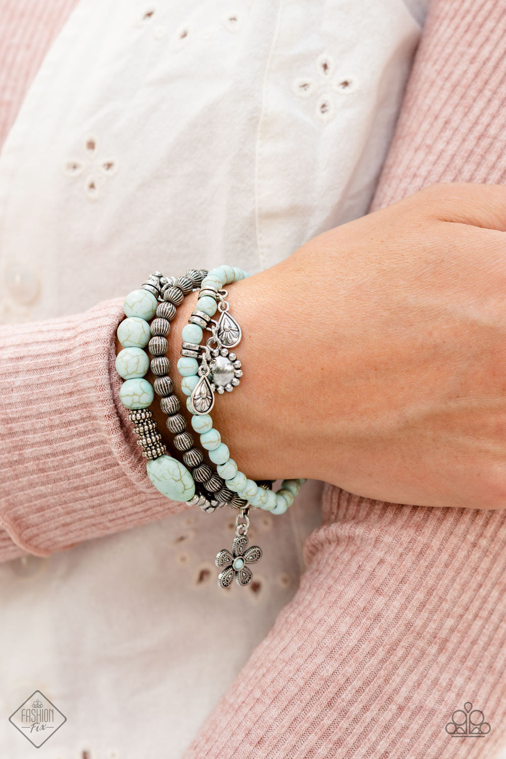 Individual Inflorescence Blue Bracelet - Paparazzi Accessories  A trio of floral-inspired bracelets, featuring comfortable stretchy bands and smooth light blue stones, stack along the wrist to create a bold statement piece.