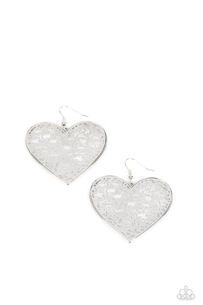 Fairest in the Land Silver Heart Earring - Paparazzi Accessories   A shiny, oversized silver heart is filled with swirls of filigree, emitting vintage whimsy as it swings from the ear. Earring attaches to a standard fishhook fitting.  Sold as one pair of earrings.