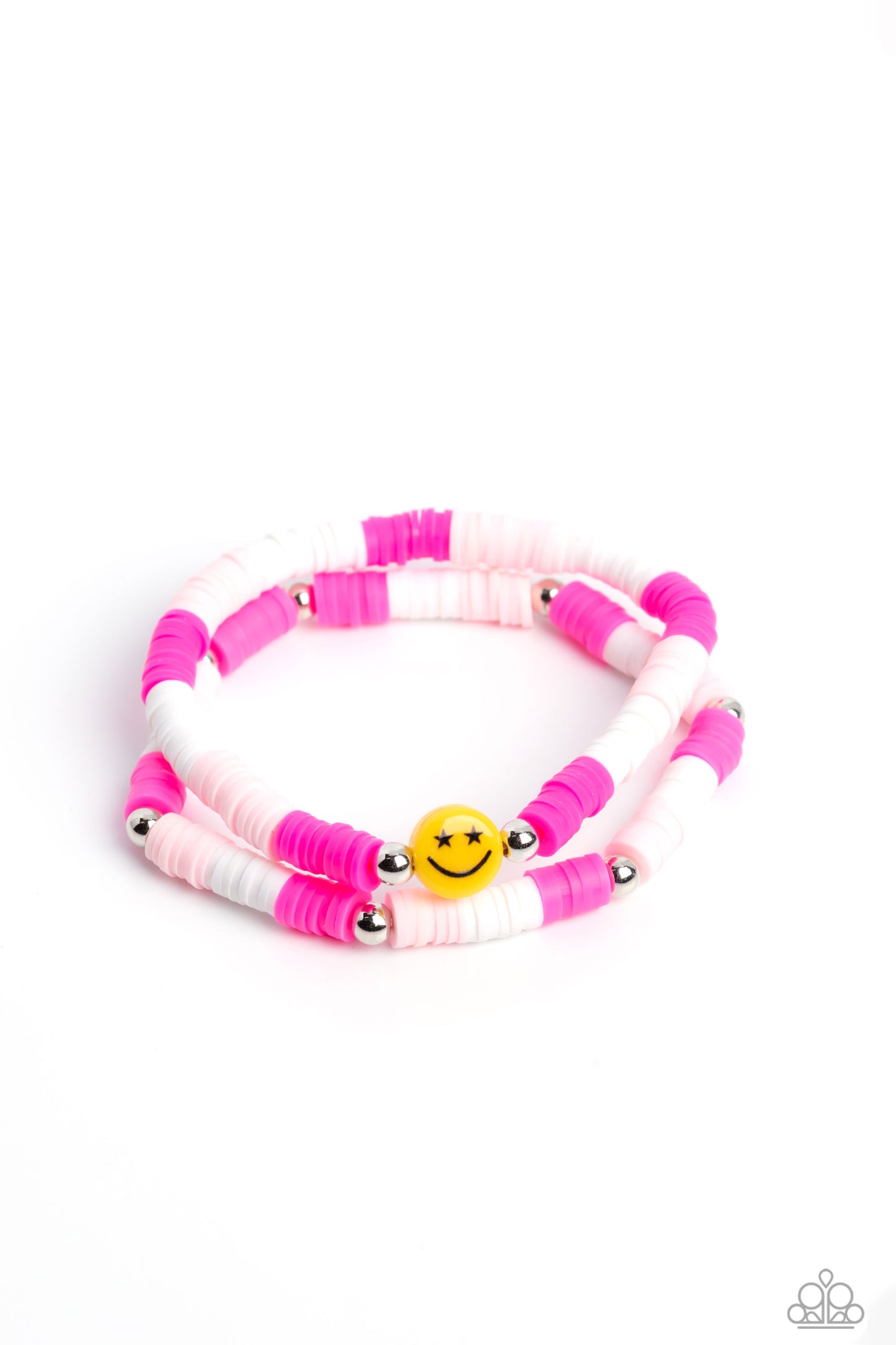 In SMILE Pink Bracelet - Paparazzi Accessories  Hot pink, baby pink, and white rubber discs combine with sporadically placed silver beads to provide a vibrant pop of color along the wrist. Meeting in the center of one of the pink-shaded bracelets, a yellow bead with a smiley face, featuring stars for eyes, rests for a youthful finish.  Sold as one set of two bracelets.  P9SE-PKXX-172XX