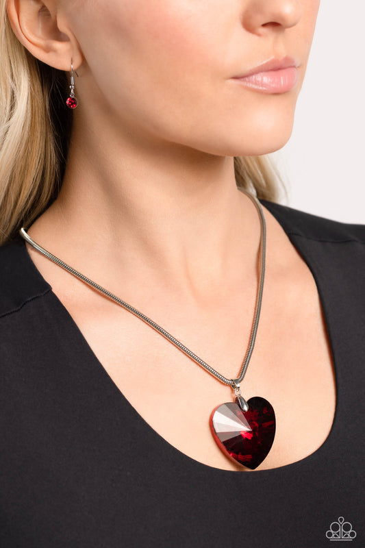 Parting is Such Sweet Sorrow Red Heart Necklace - Paparazzi Accessories  Featuring a glossy finish, an oversized, faceted, red heart gem swings from the bottom of a thick silver snake chain below the collar for a romantic declaration. Features an adjustable clasp closure.  Sold as one individual necklace. Includes one pair of matching earrings.  P2ST-RDXX-123XX