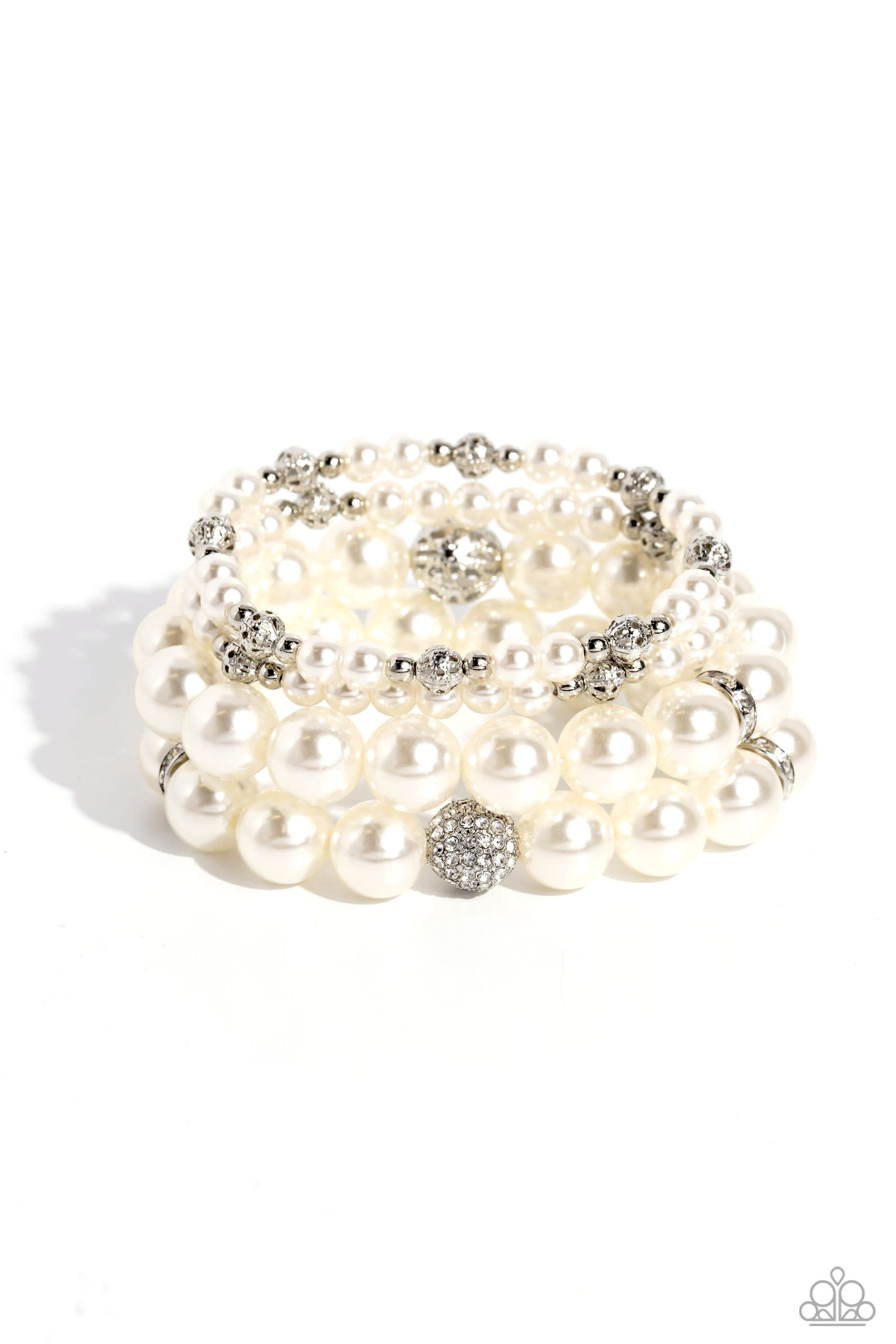 Vastly Vintage White Pearl Bracelet - Paparazzi Accessories  Infused with white rhinestone-encrusted silver beads, white rhinestone-encrusted discs, and textured silver beads, a bubbly collection of mismatched white pearls are threaded along stretchy bands around the wrist for a vintage-inspired layered look.  Sold as one set of four bracelets.  P9RE-WTXX-565XX