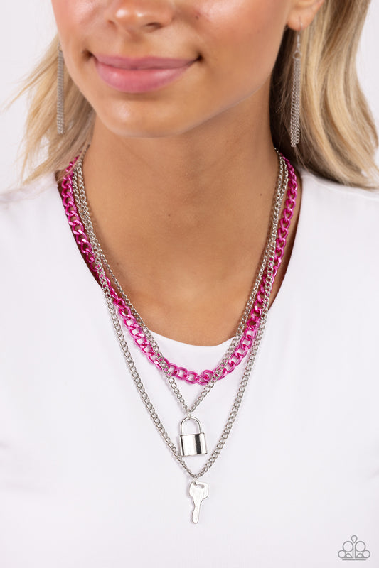 Locked Labor Pink Necklace - Paparazzi Accessories  A sleek silver lock and silver key trickle from the bottoms of glistening silver chains down the chest, creating industrial layers. A pink curb chain hangs above the pendants for a touch of colorfully gritty sheen. Features an adjustable clasp closure.  Sold as one individual necklace. Includes one pair of matching earrings.  P2BA-PKXX-023XX