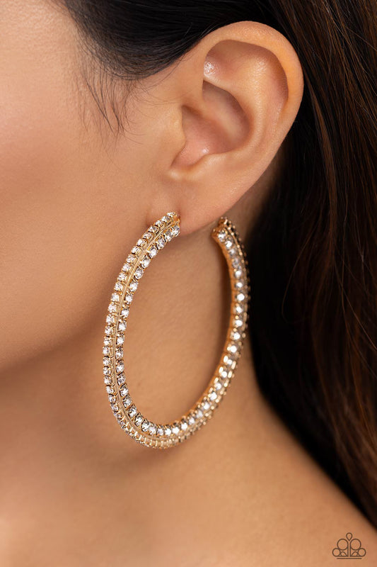 Scintillating Sass Gold Hoop Earring - Paparazzi Accessories  Glittery white rhinestones are encrusted along the front and side of a textured tread-like oversized gold hoop for a sassy finish. Earring attaches to a standard post fitting. Hoop measures 2 1/2" in diameter.  Sold as one pair of hoop earrings.  P5HO-GDXX-322XX