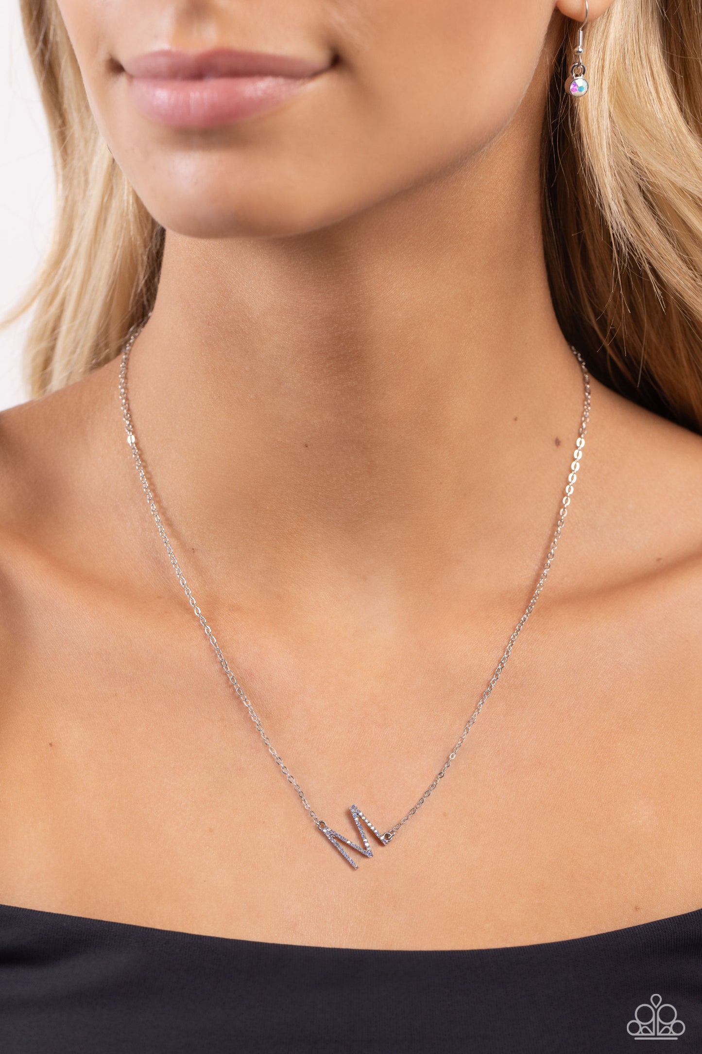 INITIALLY Yours Multi "M" Necklace - Paparazzi Accessories  Embossed with dainty iridescent rhinestones, a silver letter "M" hovers below the collar from a dainty silver chain, for a sentimentally simple design. Features an adjustable clasp closure. Due to its prismatic palette, color may vary.  Sold as one individual necklace. Includes one pair of matching earrings.  P2DA-MTXX-136XX